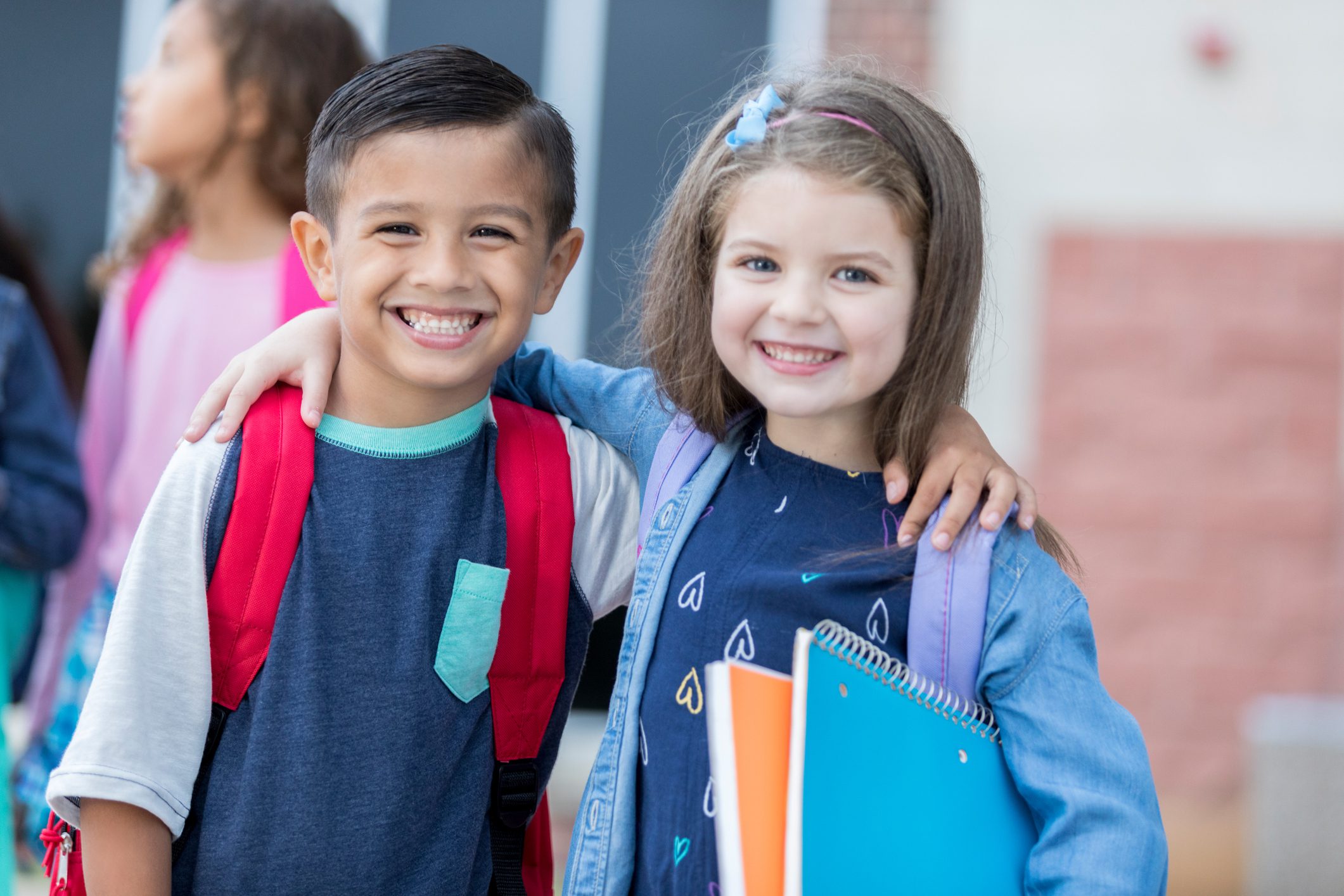 Children excited for their first day back at school.